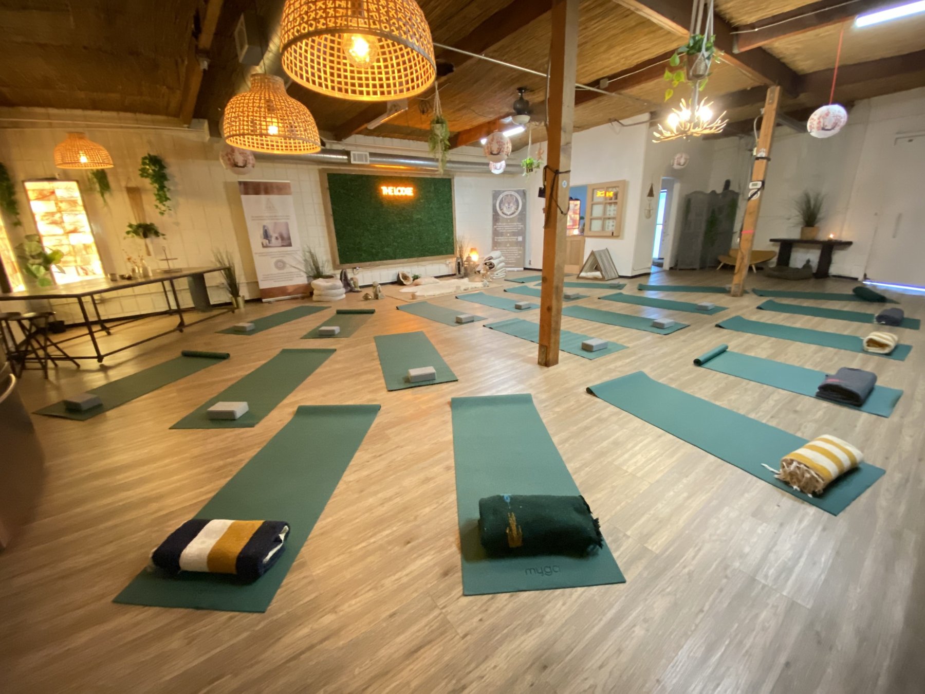 DEN wellness room prepared for a yoga and sound bath gathering